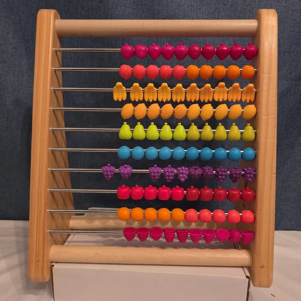 B. Toys Two-Ty Fruity Wooden Abacus Toy Textured Fruit Counting Math Board
